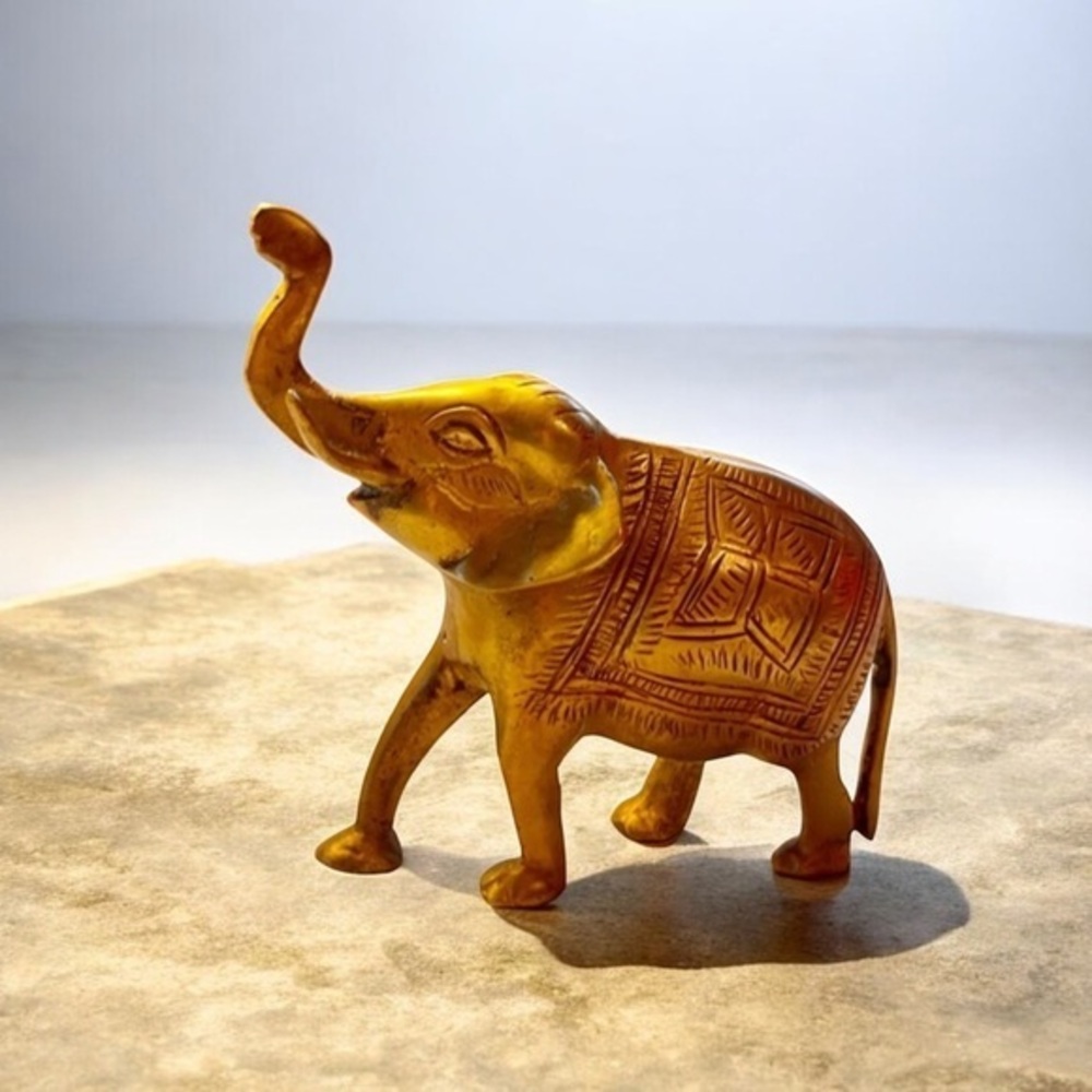 - Vintage brass elephant trunk up